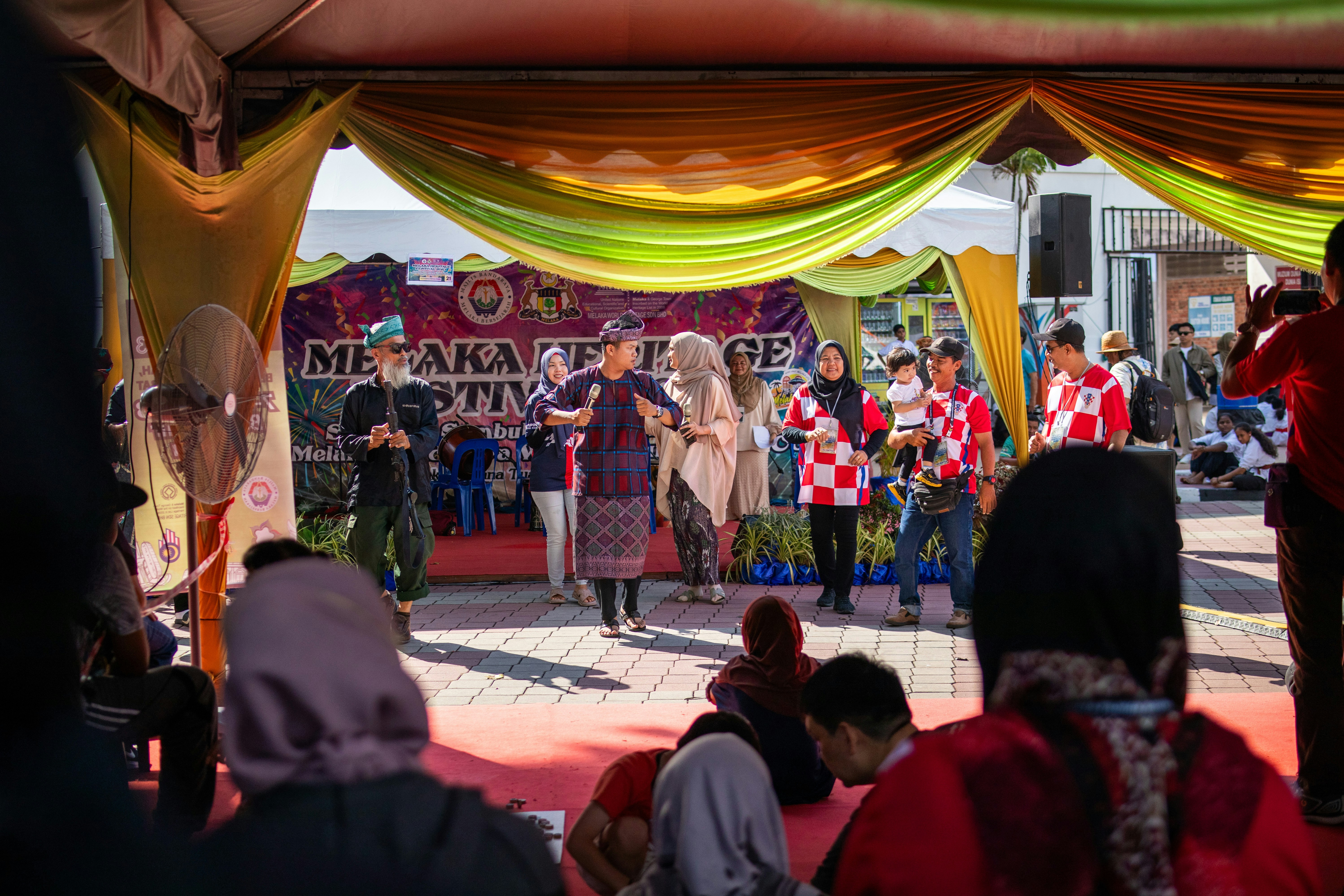 a group of people standing on top of a stage