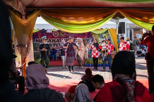 A colorful collage of guests and performers sharing smiles and stories on the Ash Variety Channel stage.