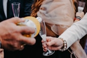 Close-up of a professional server pouring prosecco at a stylish event.