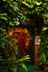 A vibrant art gallery entrance bathed in warm black and gold lighting inviting visitors inside.