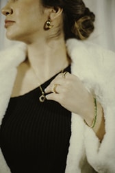 A happy customer wearing elegant jewellery at a festive party.