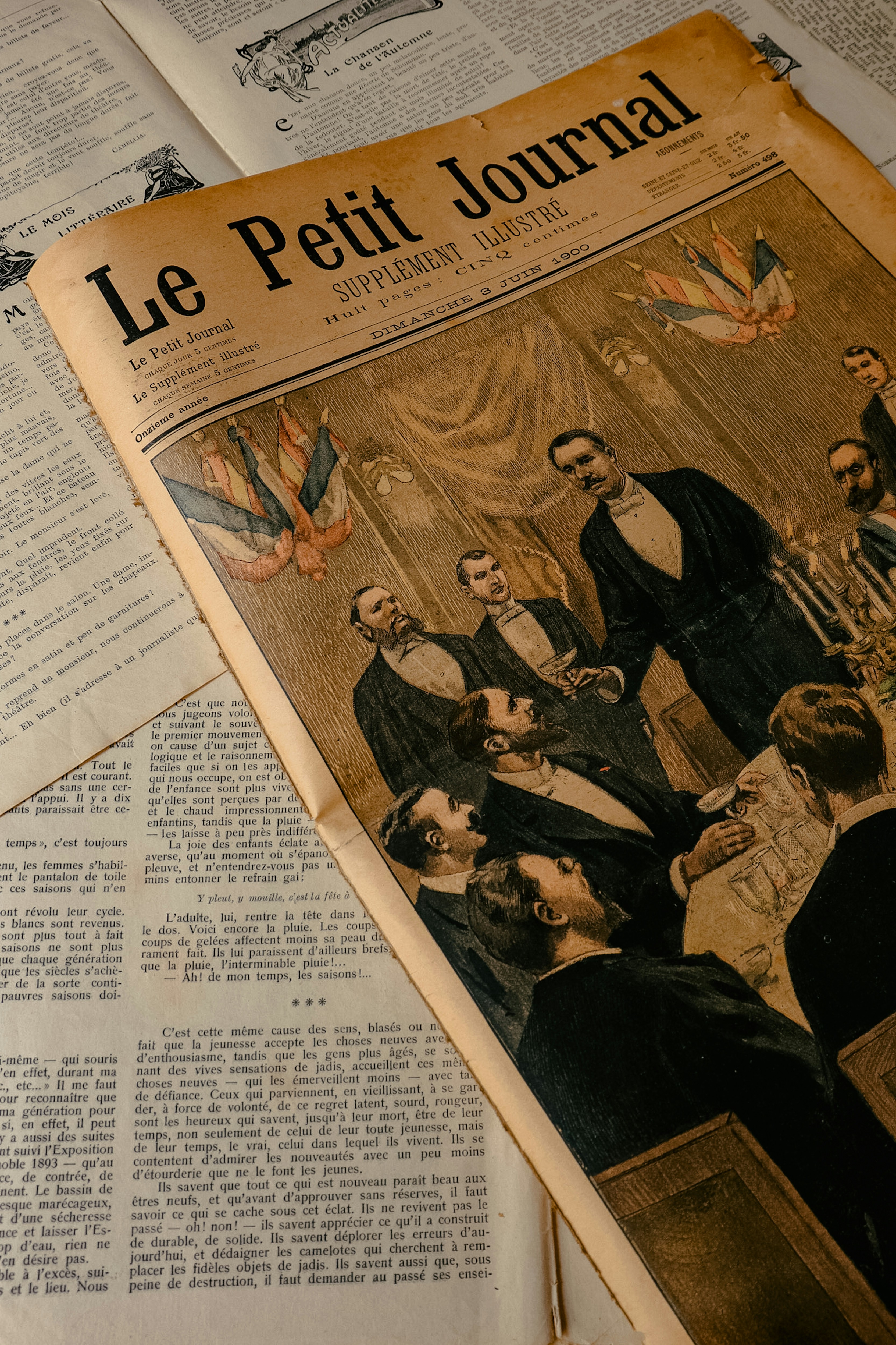 A newspaper with a picture of a group of people photo – Free Paris ...