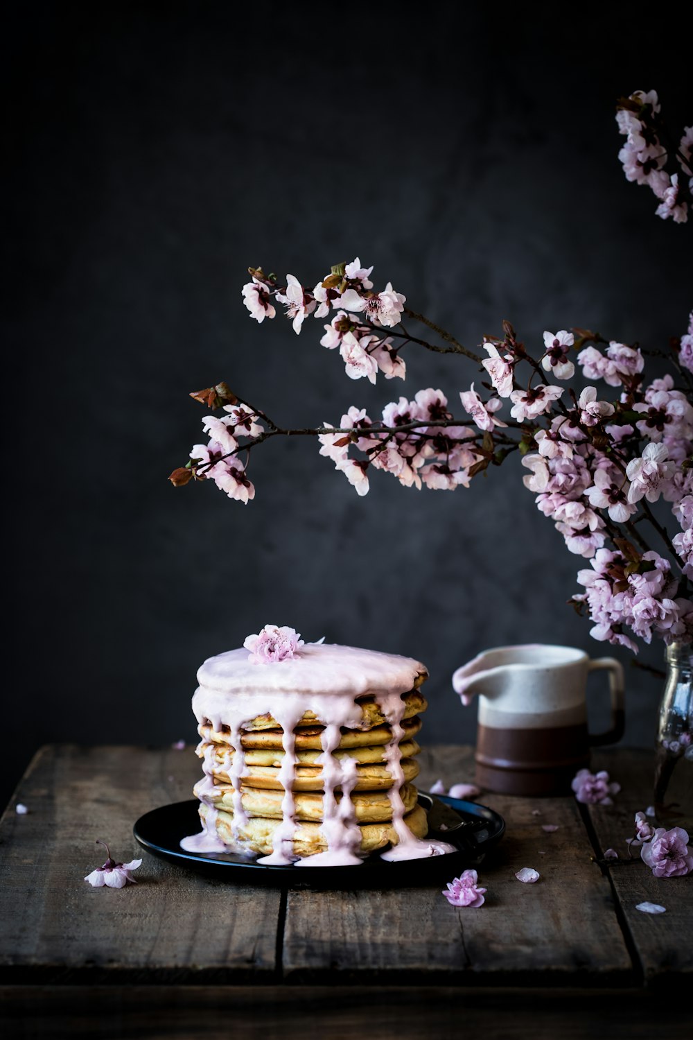 a cake with icing on top of a wooden table