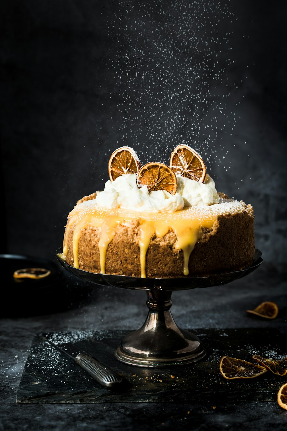 a cake covered in icing and orange slices