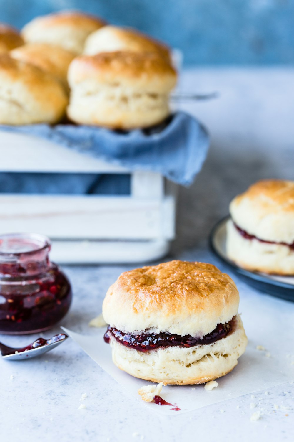 a close up of a plate of biscuits and jam