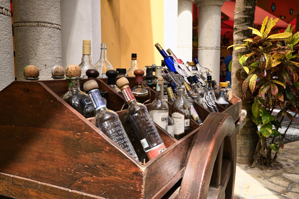 a wooden box filled with lots of bottles