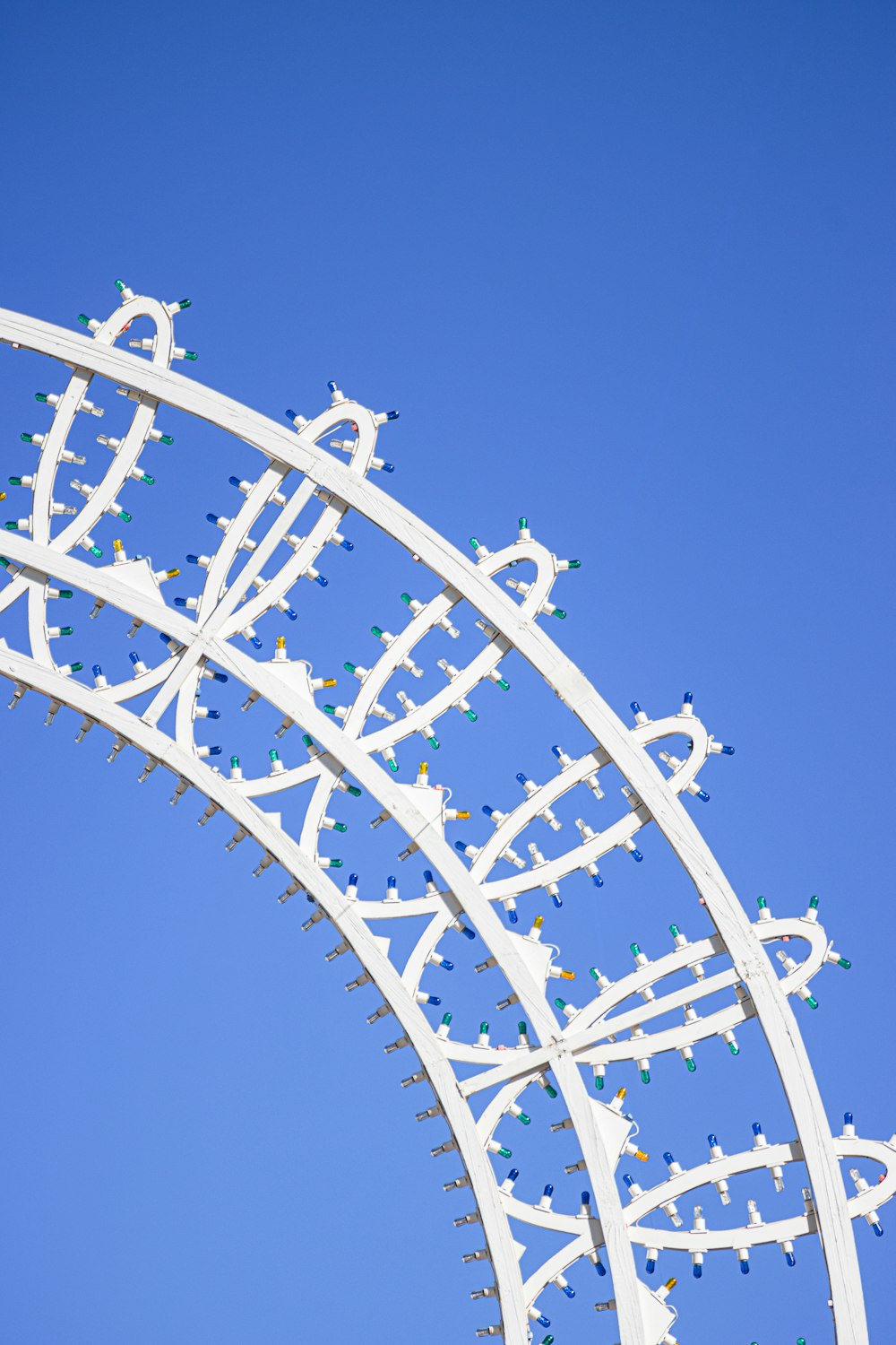 a large metal structure with a blue sky in the background