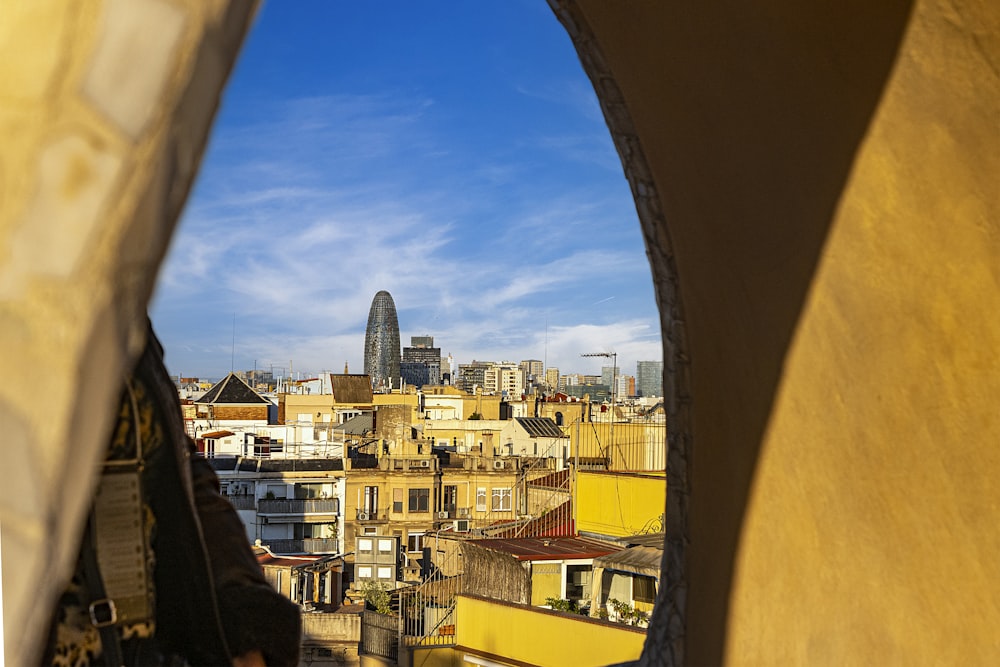 a view of a city from a window in a building