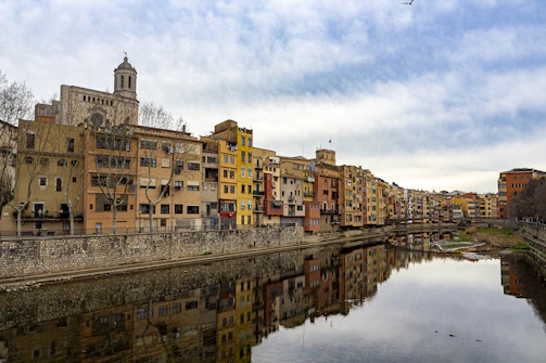 a river running through a city next to tall buildings