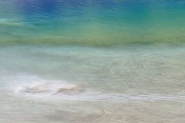 A serene scene of soft waves blending into warm neutral tones, evoking calm and mindfulness.