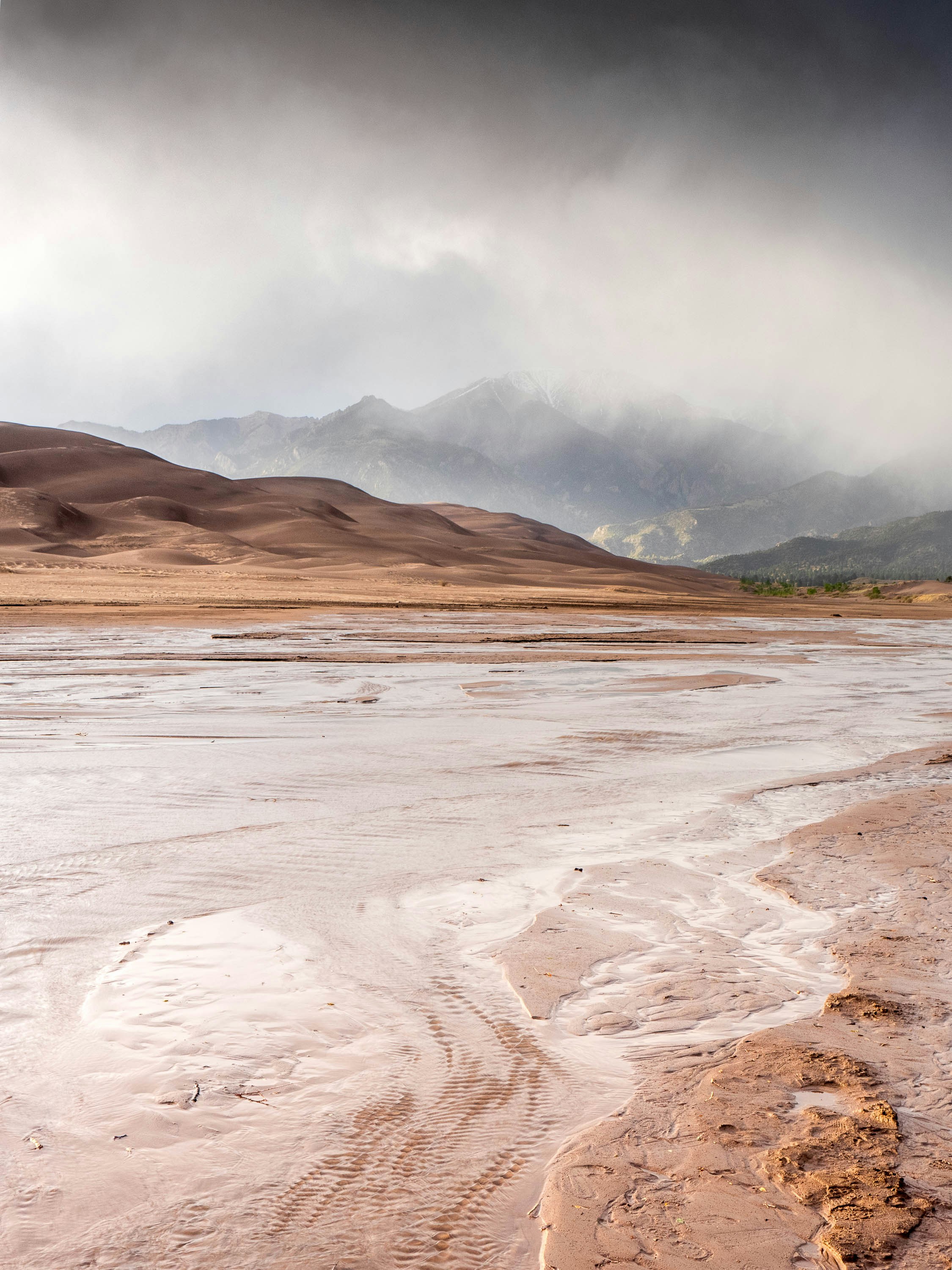 a-large-body-of-water-sitting-under-a-cloudy-sky-photo-free-colorado