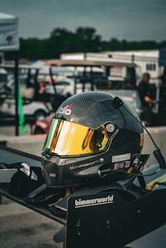 a helmet on the back of a motorcycle