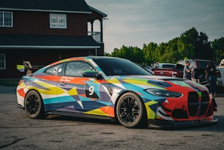 a colorful car parked in a parking lot