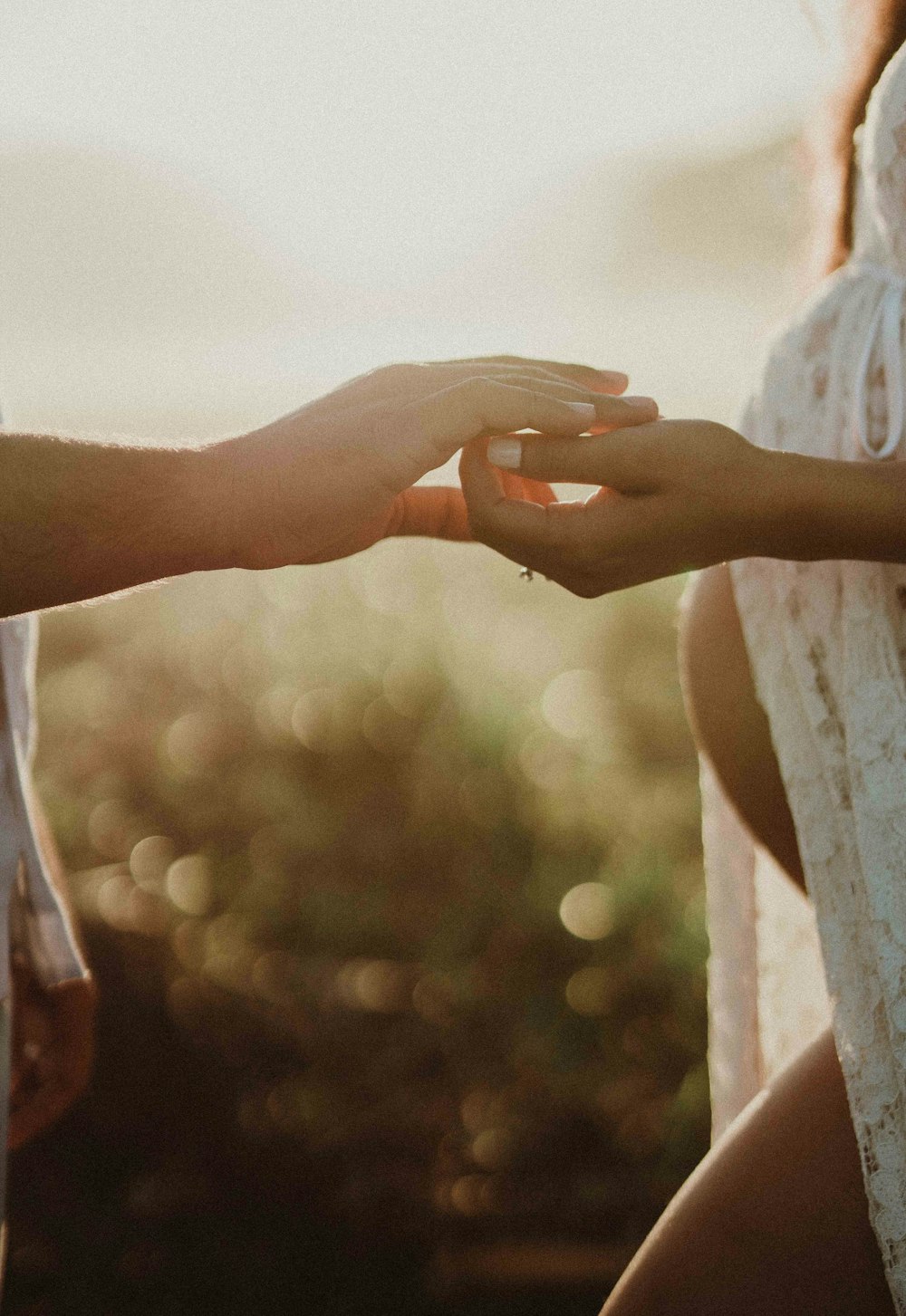 a man and a woman are holding hands