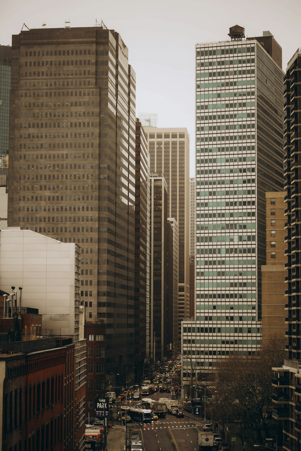 a view of a city street with tall buildings