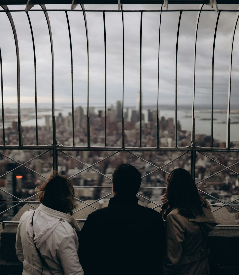 a couple of people that are looking at a city