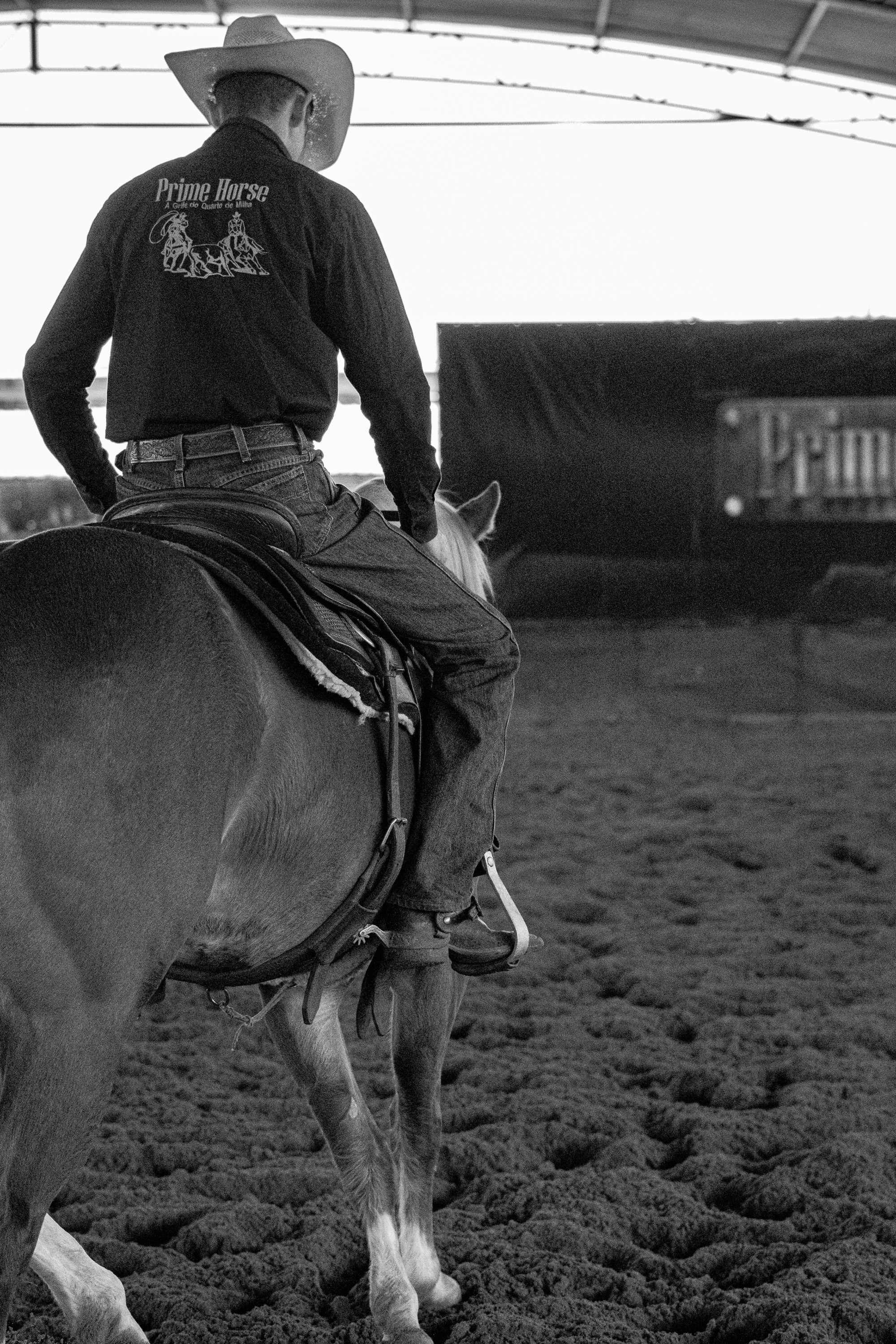 a man riding on the back of a brown horse