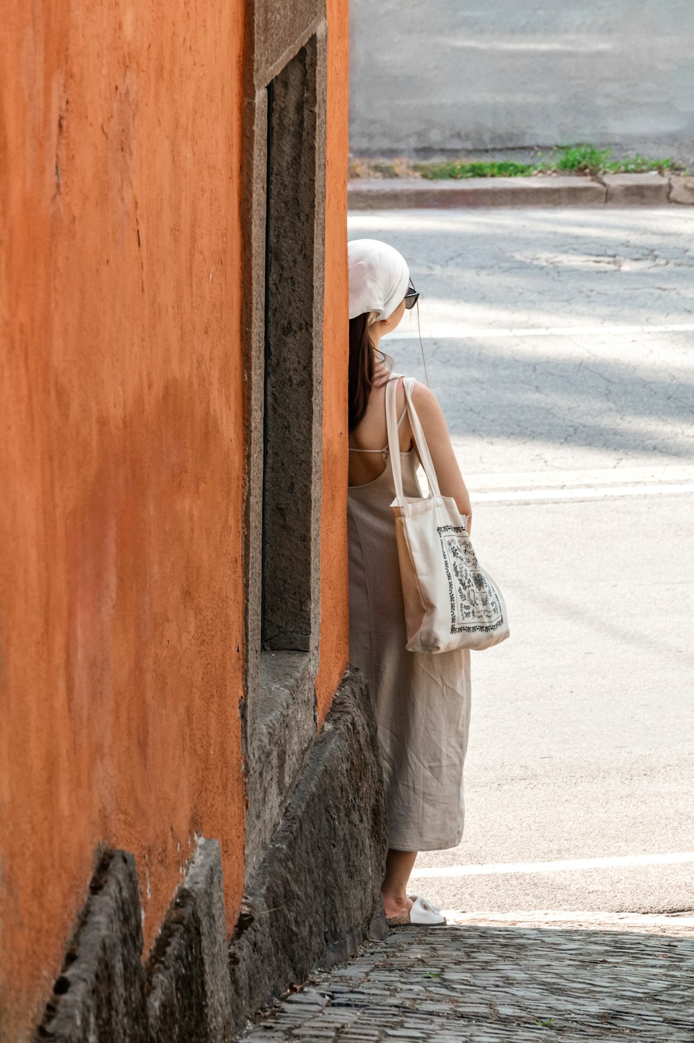 a woman is standing outside of a building