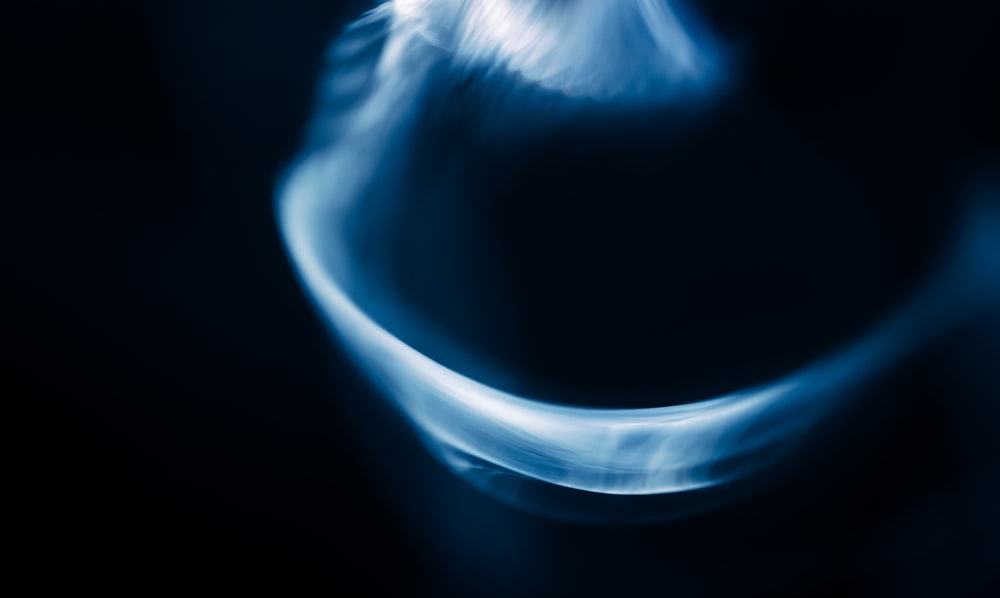 a blurry photo of a blue object in the dark