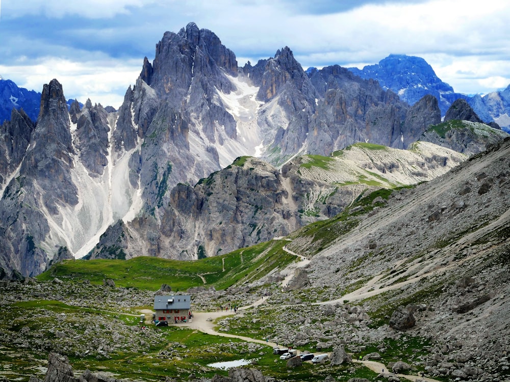 a house in the middle of a mountain range