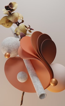 A surreal composition featuring a combination of natural and abstract elements. There are curved, fan-like structures in shades of orange, alongside spherical and tubular shapes with a textured appearance. Yellow, brown-hued flowers with subtle details intertwine with these elements, creating a harmonious balance of organic and geometric forms.