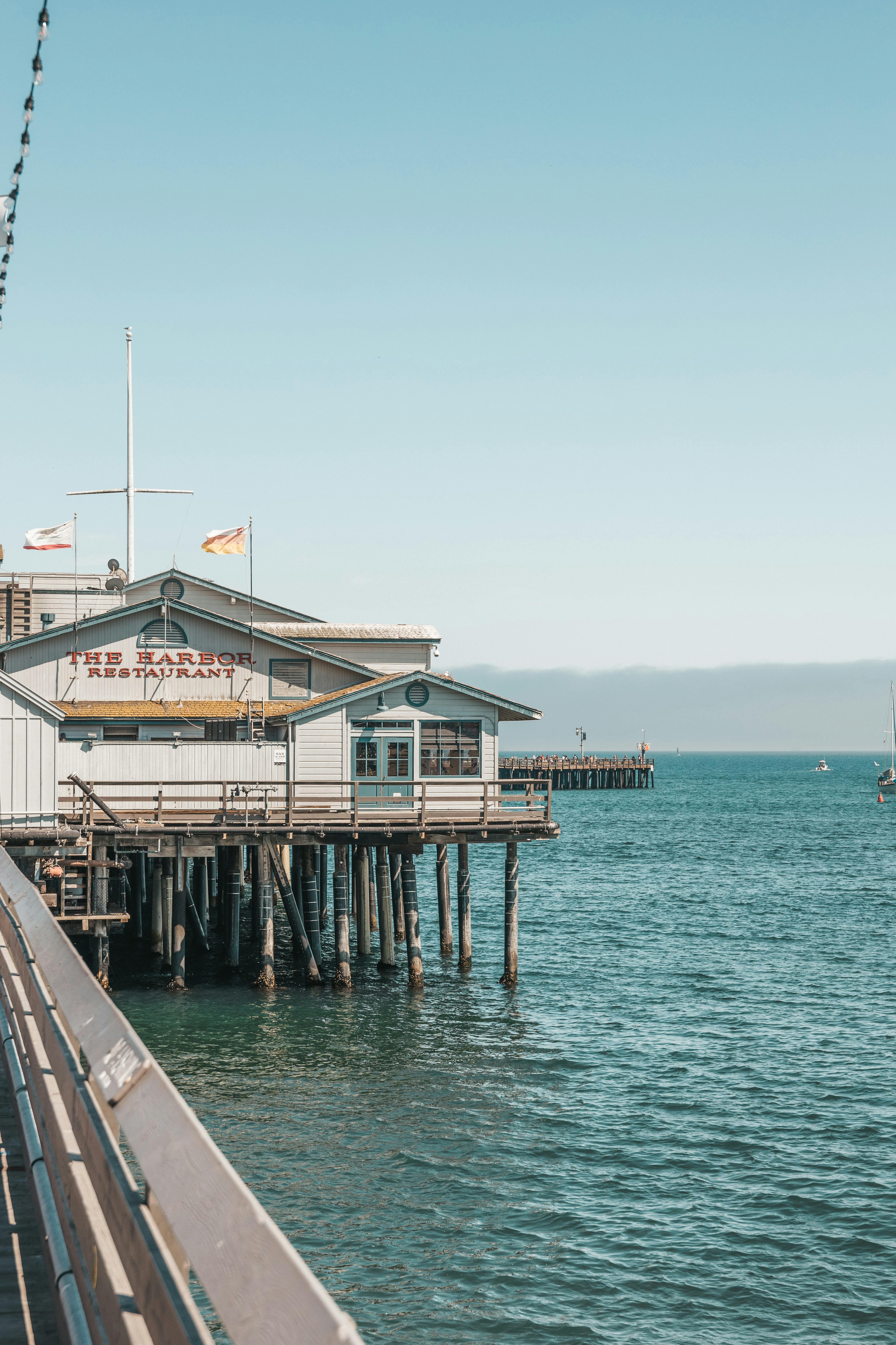 a pier with a boat in the water