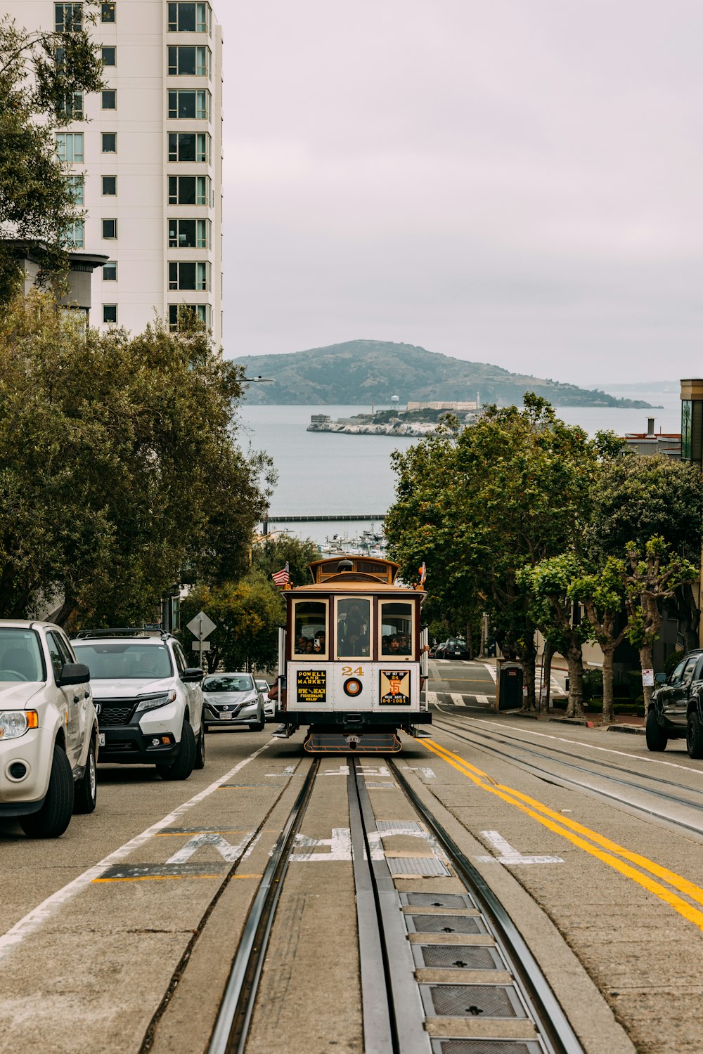 a trolley car is traveling down the tracks