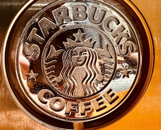 a close up of a starbucks sign on a door