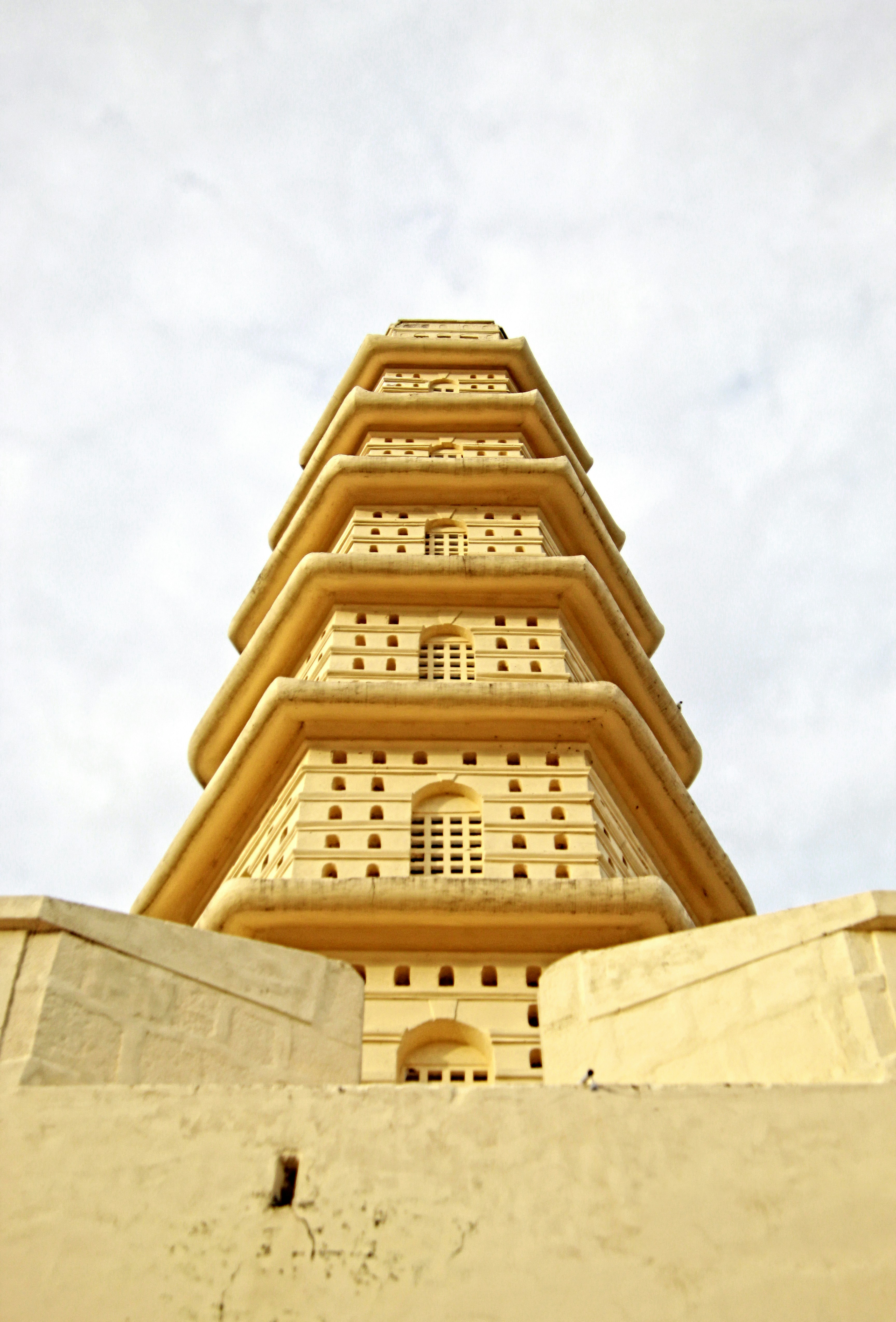 a tall tower with a clock on the top of it