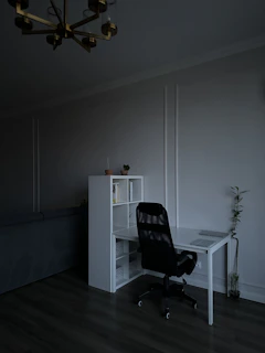 Minimalist home office with clean white desk, natural light, and calming decor