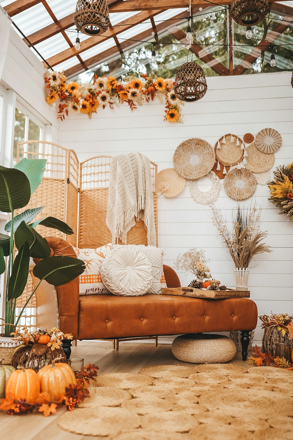a living room filled with lots of fall decorations