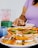 A happy customer enjoying food from Ingrid Romana.