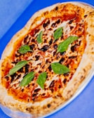 A vibrant margherita pizza fresh out of the oven, cheese bubbling and basil leaves bright.