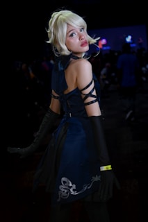 An elegant adult with fairy hair at a private event.