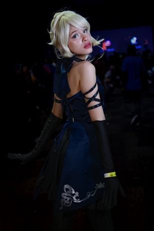 An elegant adult with fairy hair at a private event.