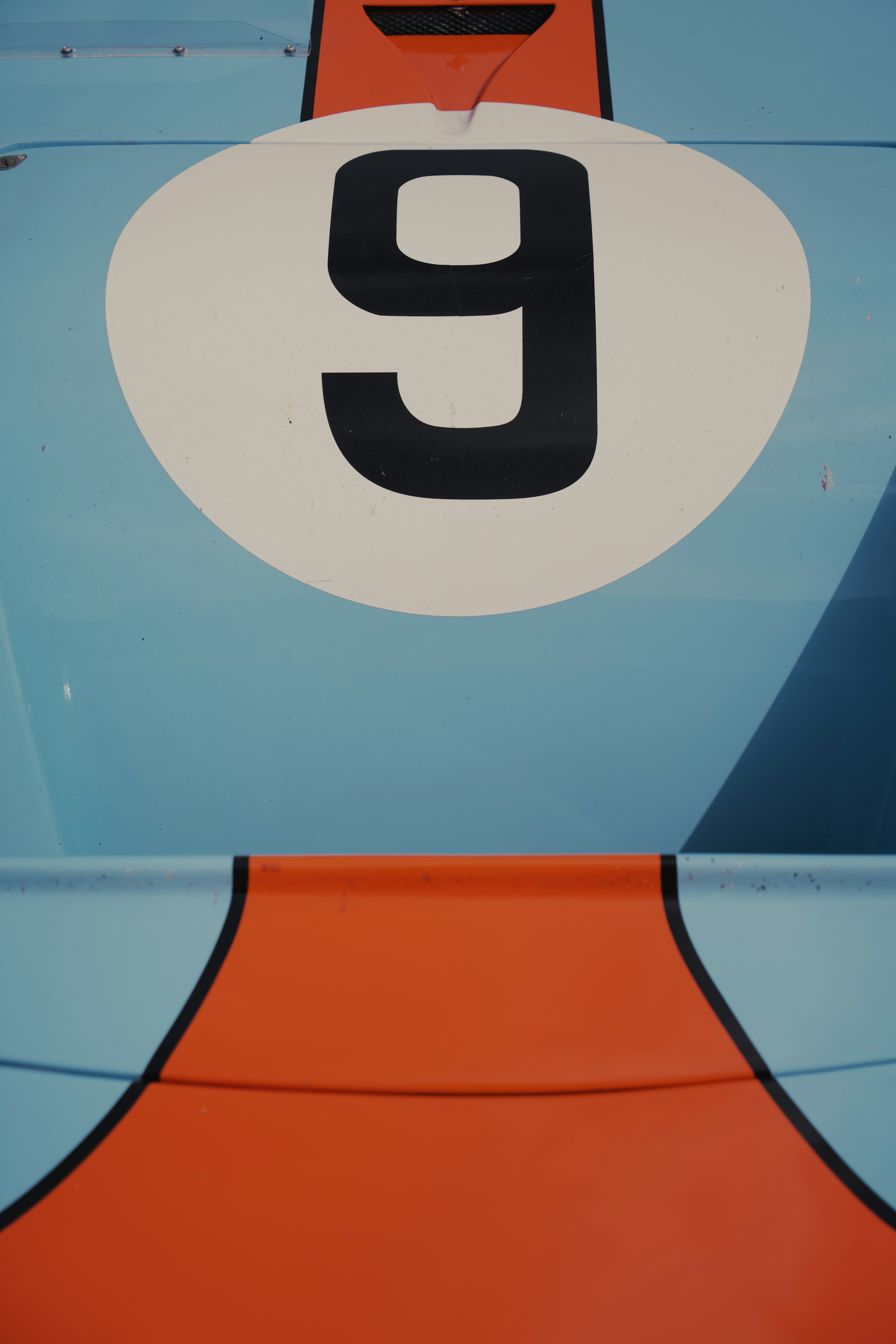 a close up of the number nine on a race car
