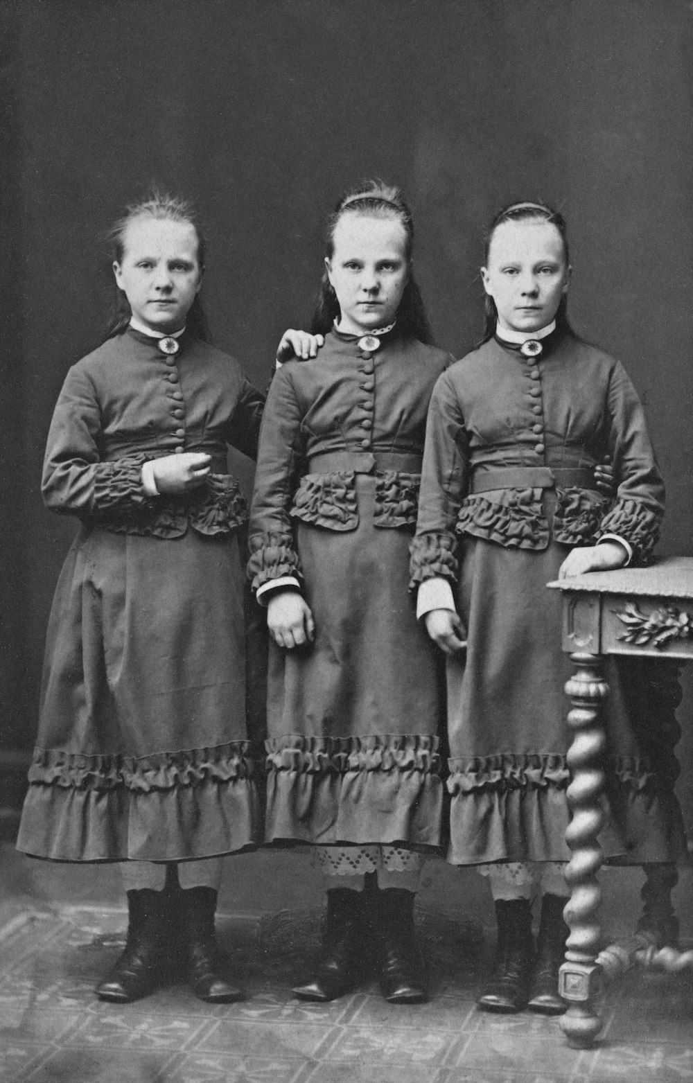 a group of young girls standing next to each other