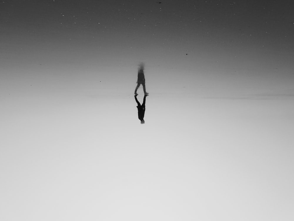 a person standing in the middle of a body of water