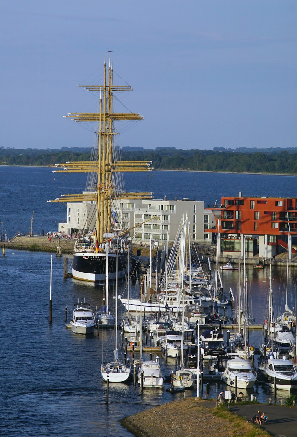 a harbor filled with lots of boats and tall buildings