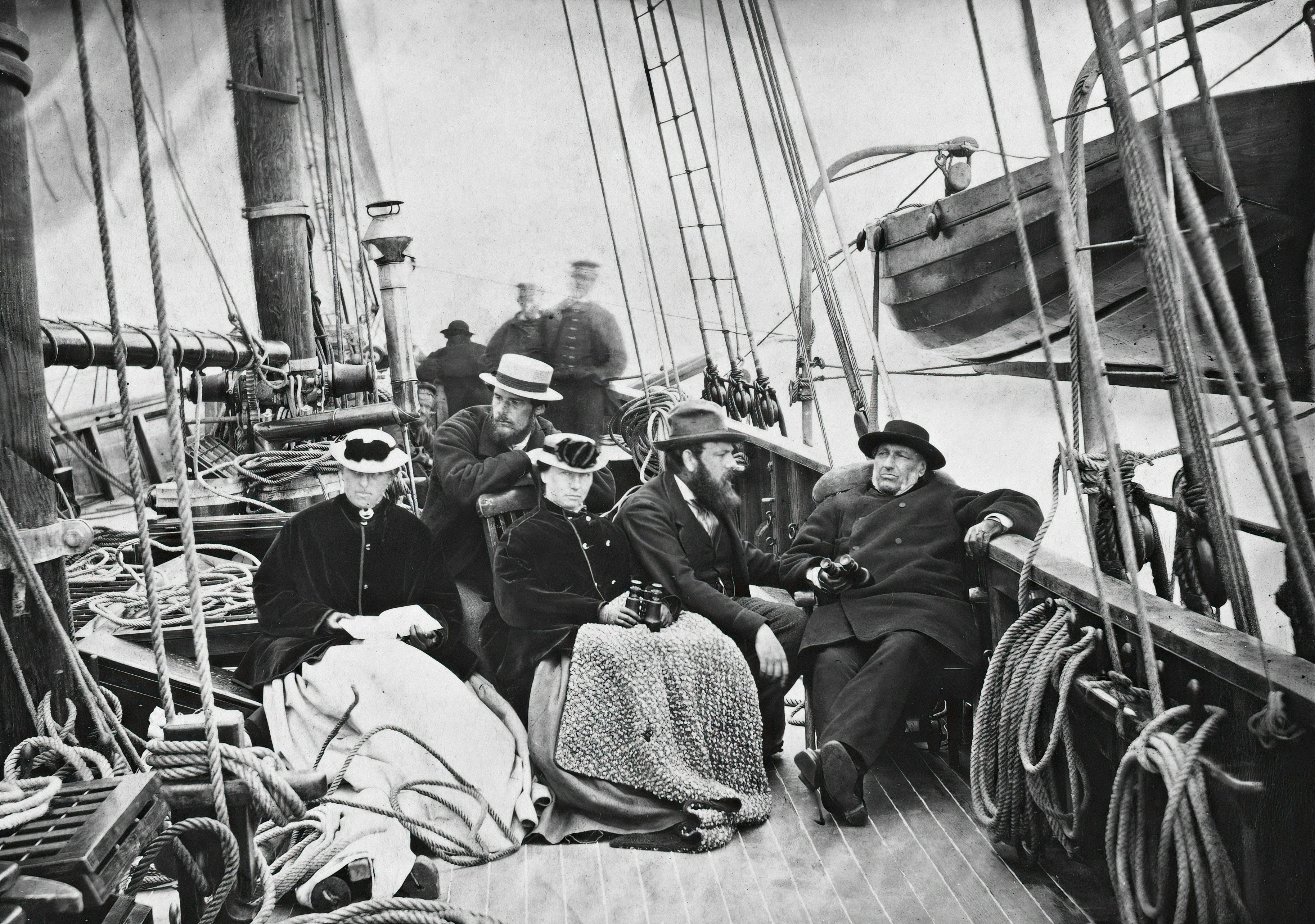 a group of people sitting on top of a boat, On board the "Nereid" 1869 ["Cruise of the "Nereid" 1869"] Tittel / Title: s. 1 On board the "Nereid" 1869 Motiv / Motif: Albuminkopi. Dato / Date: 1869 Fotograf / Photographer: Edward Backhouse Mounsey (1840-1911) Sted / Place: ukjent / unknown Bildesignatur / Image Number: bldsa_Alb_BH004 https://www.flickr.com/photos/national_library_of_norway/7779750474/in/album-72157631078724960/