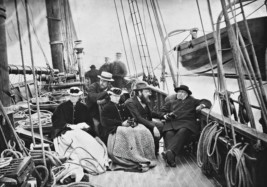 a group of people sitting on top of a boat, On board the