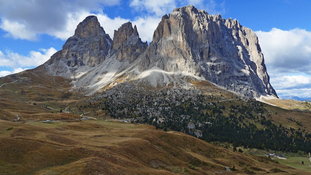 a group of mountains with a sky background