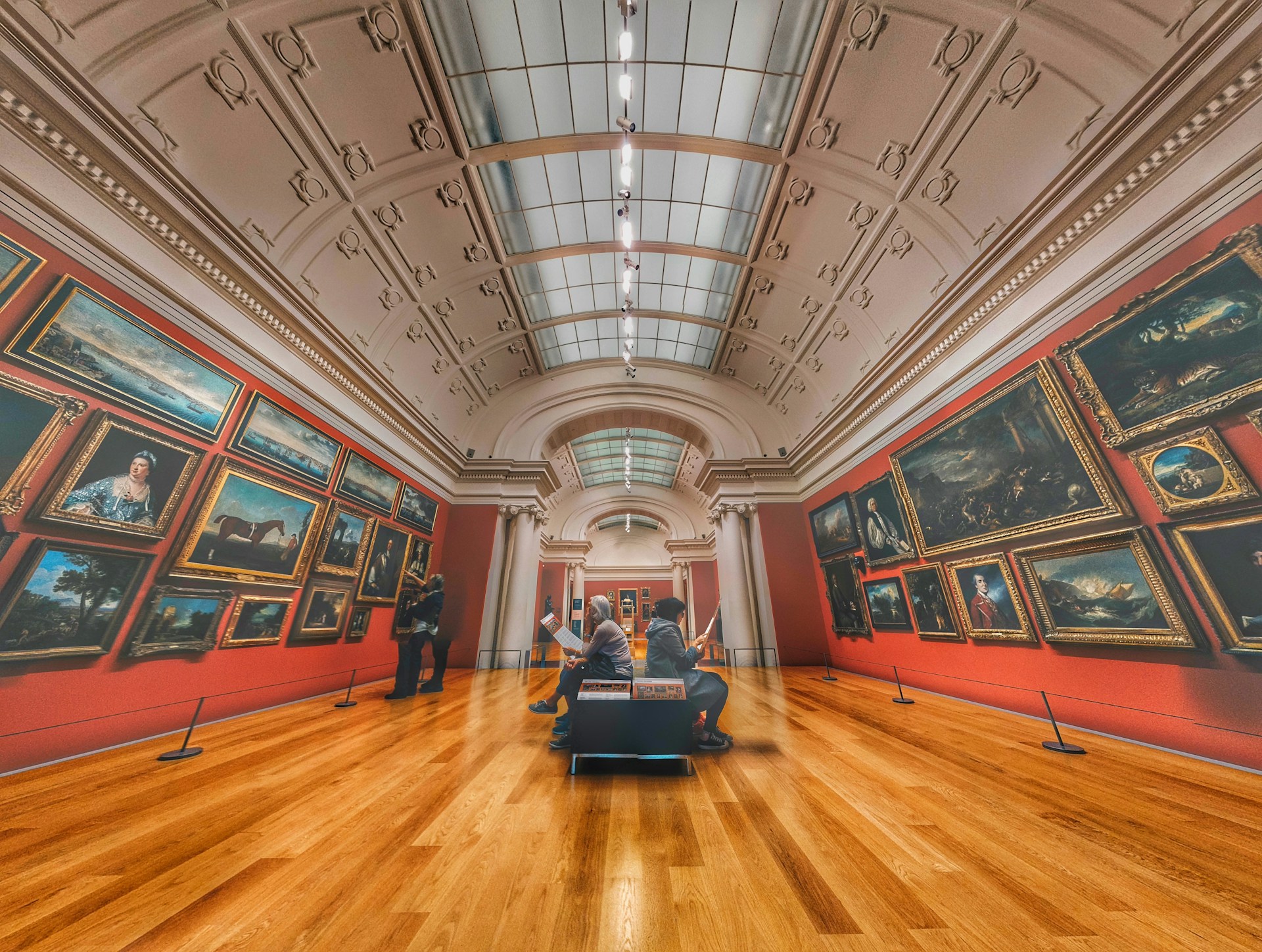 woman wearing yellow long-sleeved dress under white clouds and blue sky during daytime