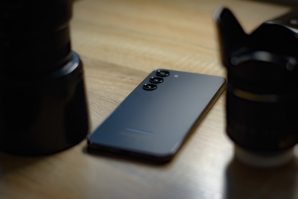 a close up of a cell phone on a table