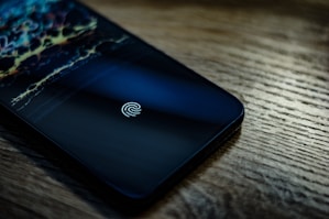 a close up of a cell phone on a table
