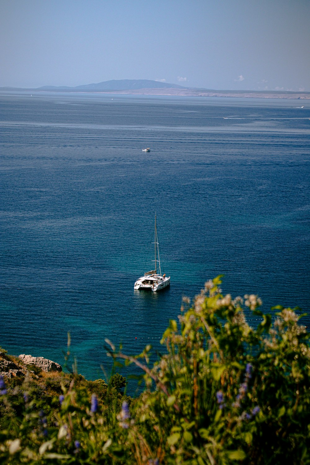 a boat floating on top of a large body of water