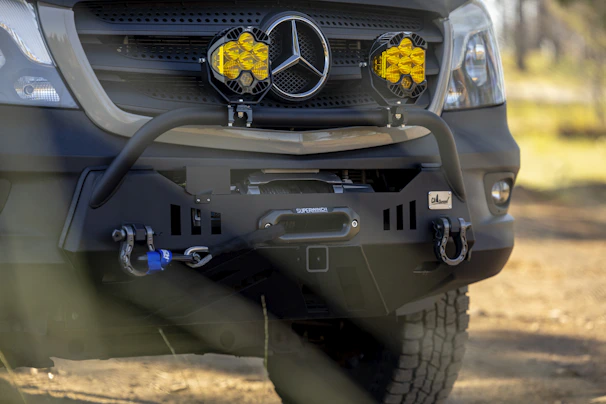 Sturdy steel bumpers mounted on a Hilux, ready for impact.