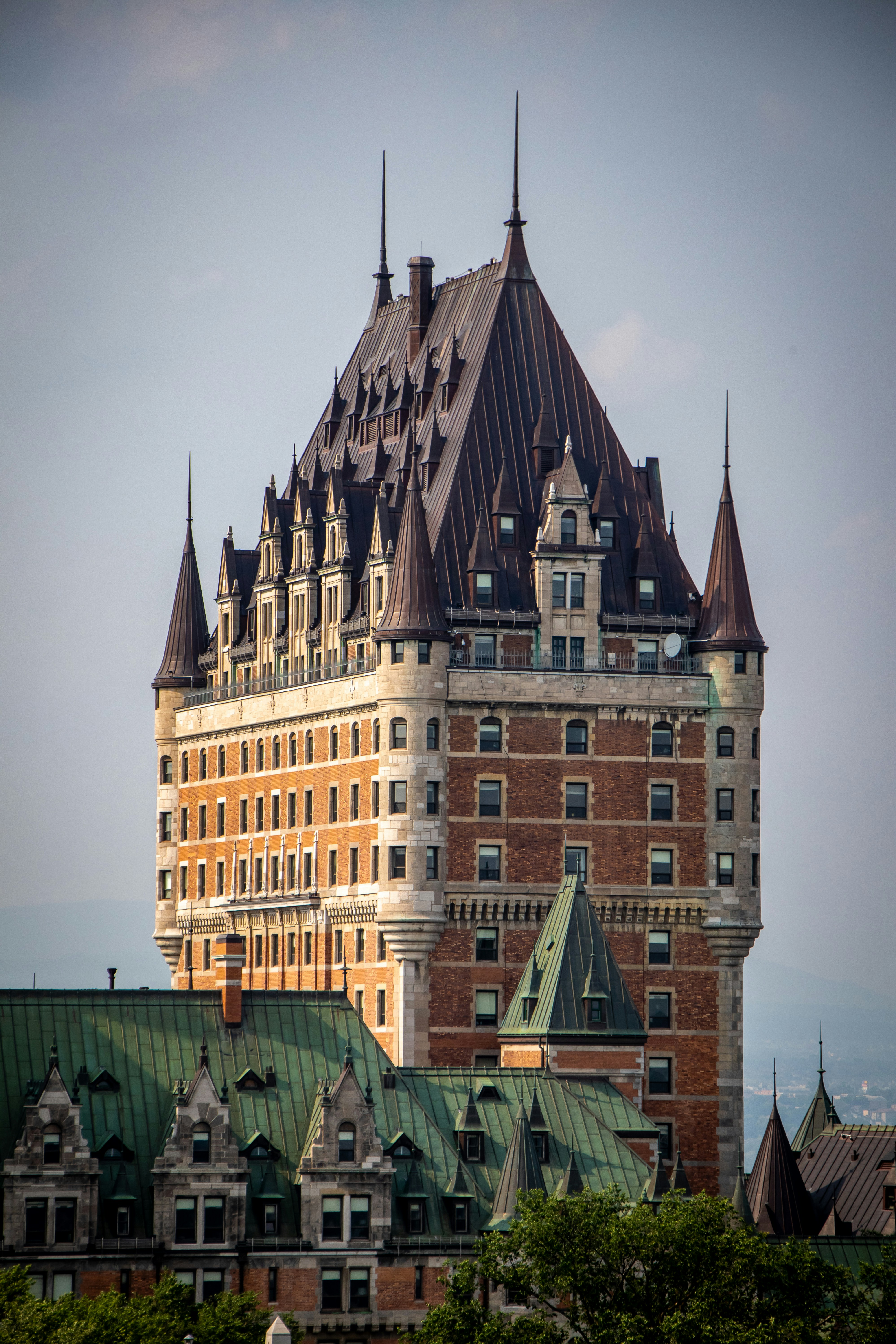 a very tall building with a green roof