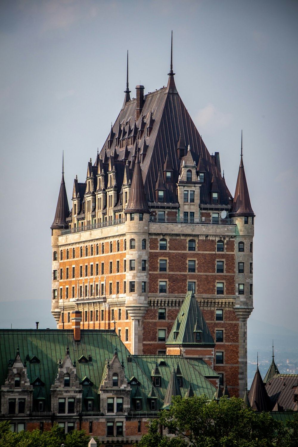 a very tall building with a green roof