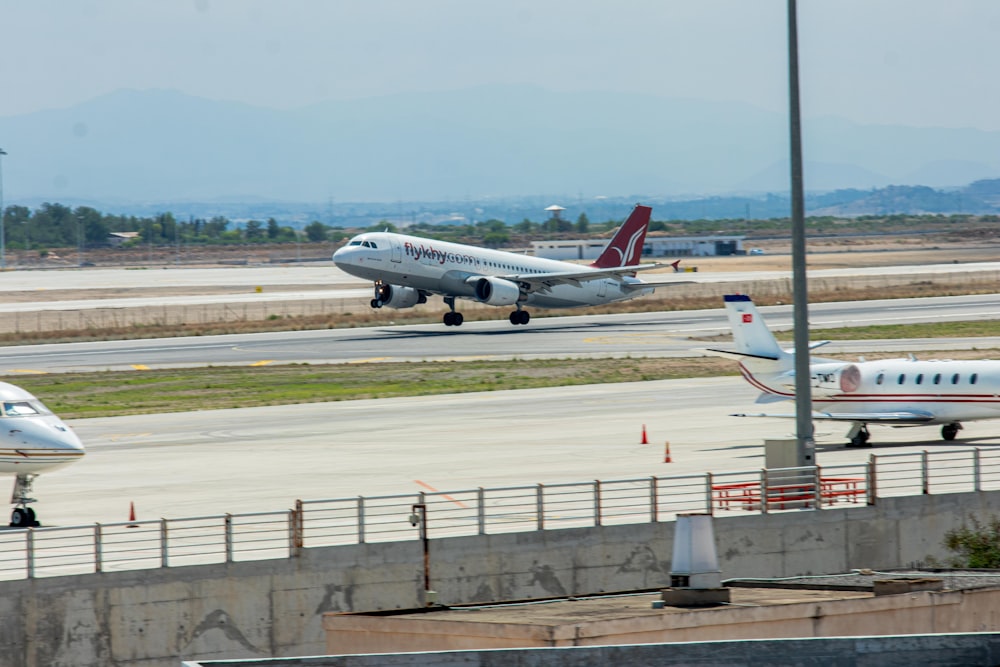 a couple of airplanes that are on a runway